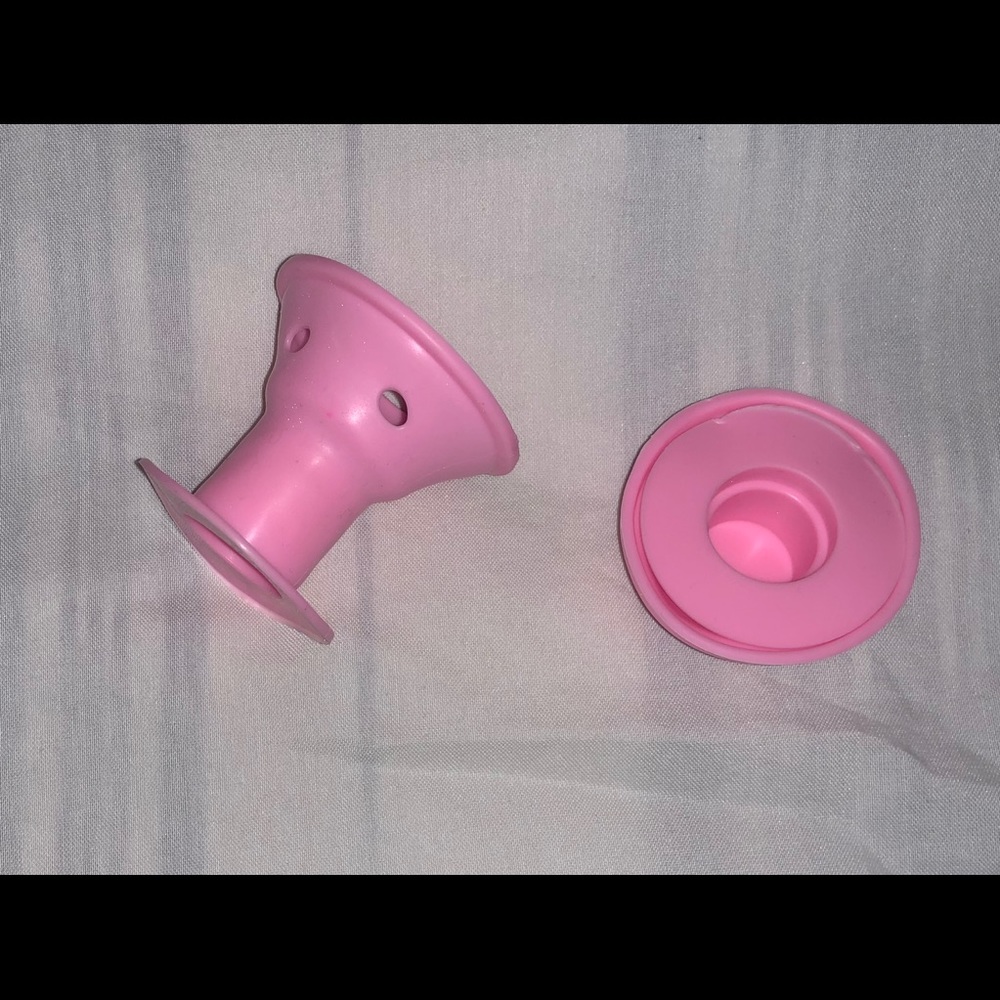 Silicone pink hair curlers.
